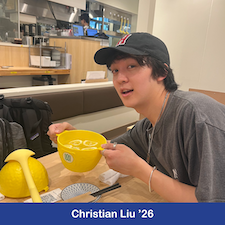 Student posing with a yellow bowl filled with lemon slices.