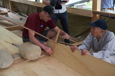 Two men, Douglas Brooks on the left, building a traditional Japanese boat