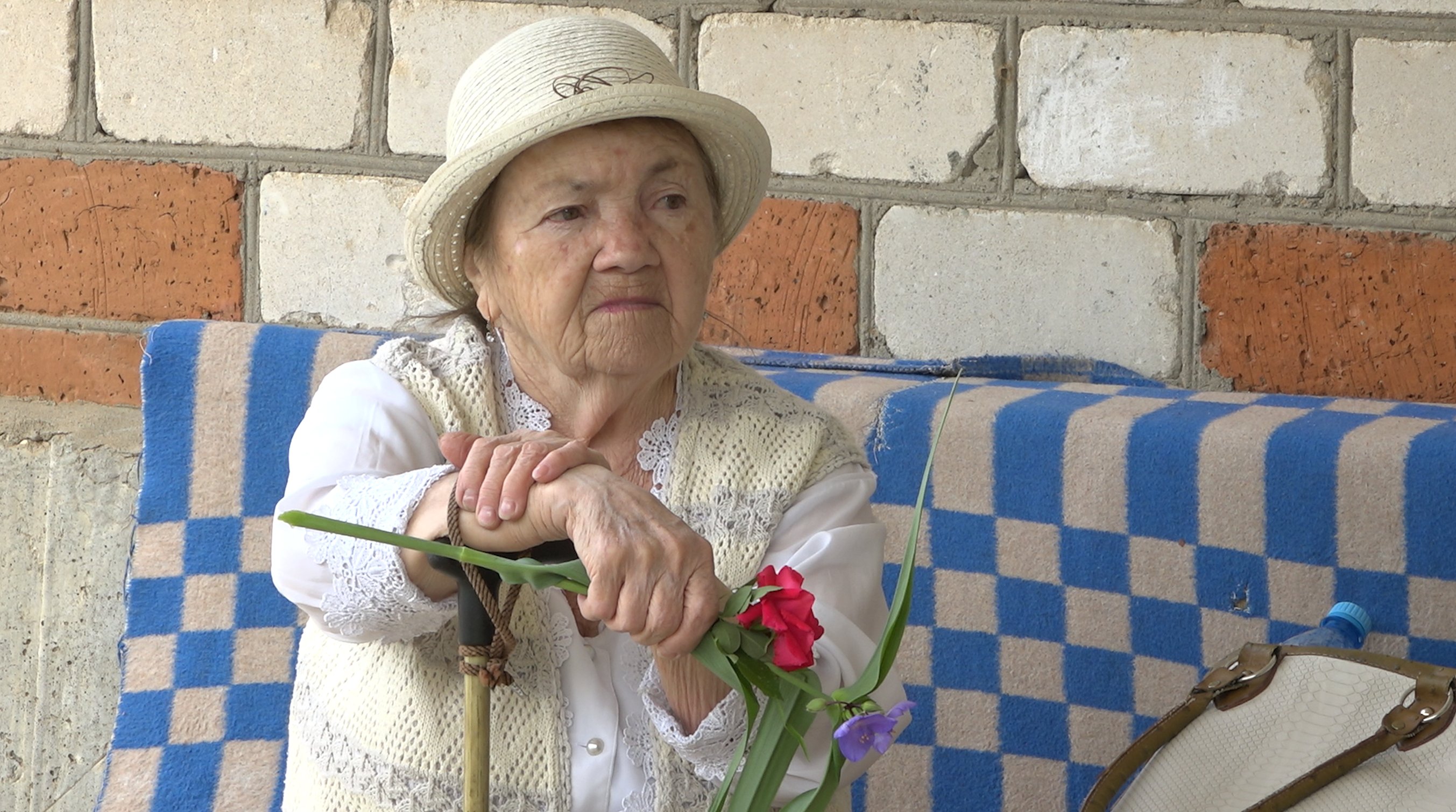 Elderly woman in garden clothes